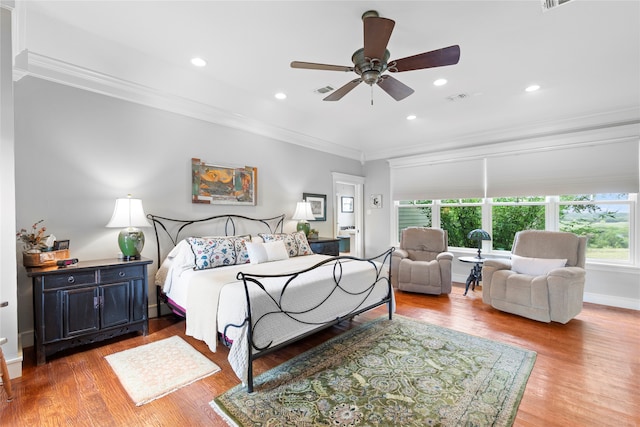 bedroom with light wood-type flooring, crown molding, and ceiling fan