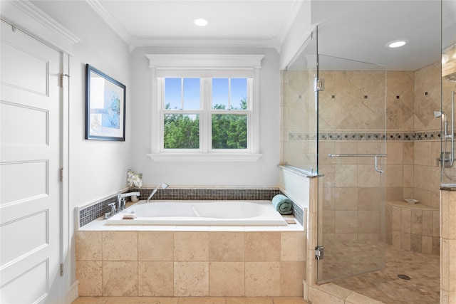 bathroom featuring separate shower and tub and ornamental molding