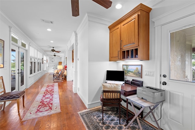 office with ceiling fan, crown molding, and wood-type flooring