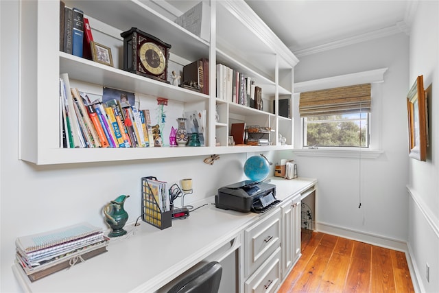 office area featuring crown molding and light hardwood / wood-style flooring