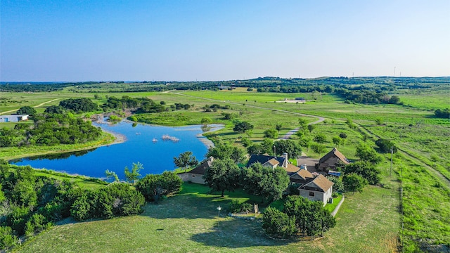 aerial view with a rural view and a water view