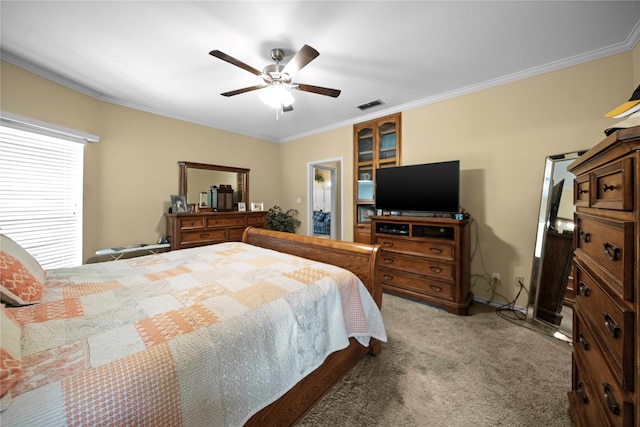 bedroom with crown molding, light colored carpet, and ceiling fan