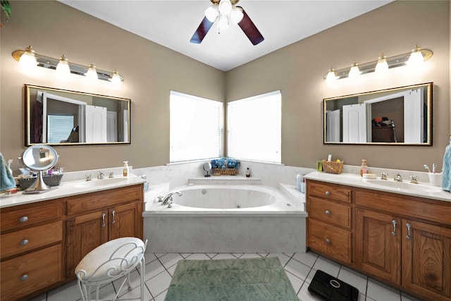 bathroom featuring vanity, a bathing tub, and tile patterned floors