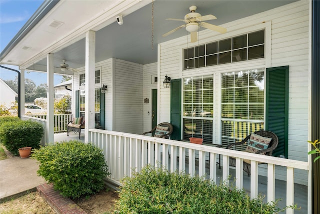 exterior space with a porch and ceiling fan