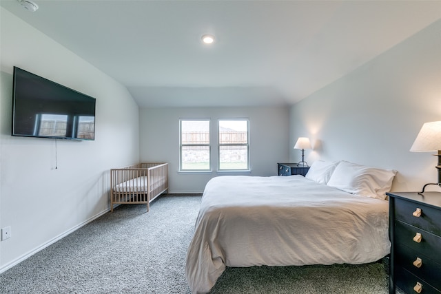 carpeted bedroom featuring lofted ceiling