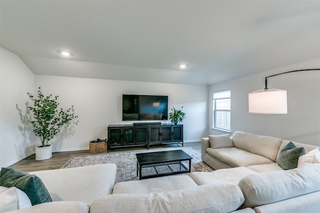 living room featuring hardwood / wood-style floors and vaulted ceiling