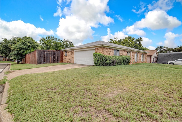 view of side of property with a garage and a lawn