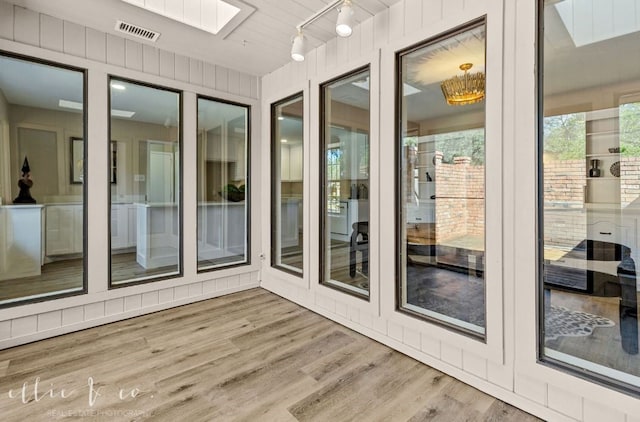 sunroom with a skylight