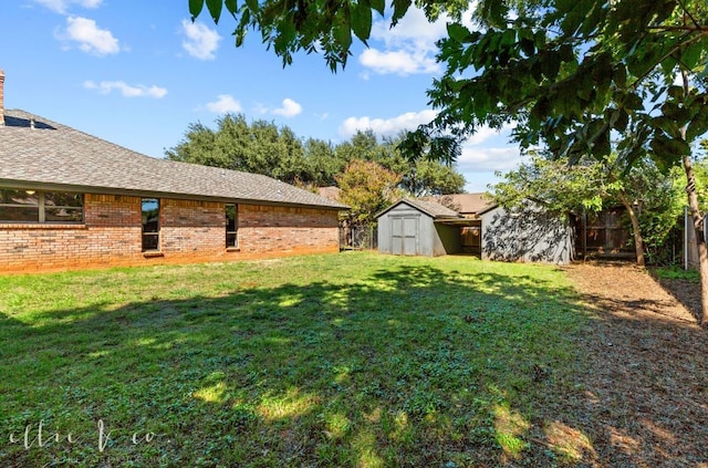 view of yard featuring a storage unit