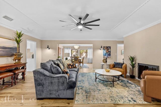 living room featuring ceiling fan and light wood-type flooring