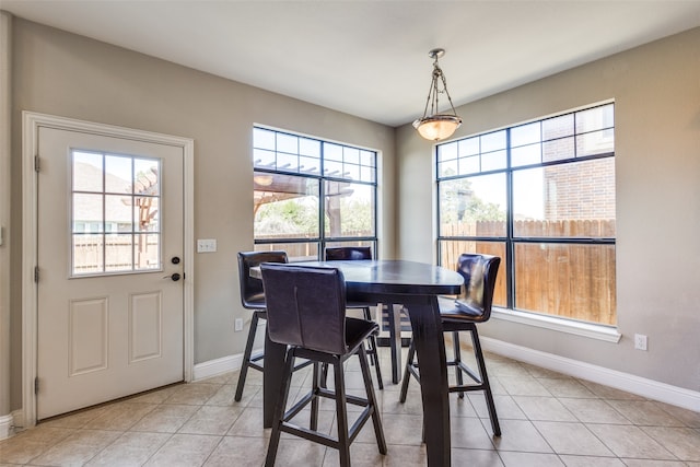 tiled dining area with a wealth of natural light