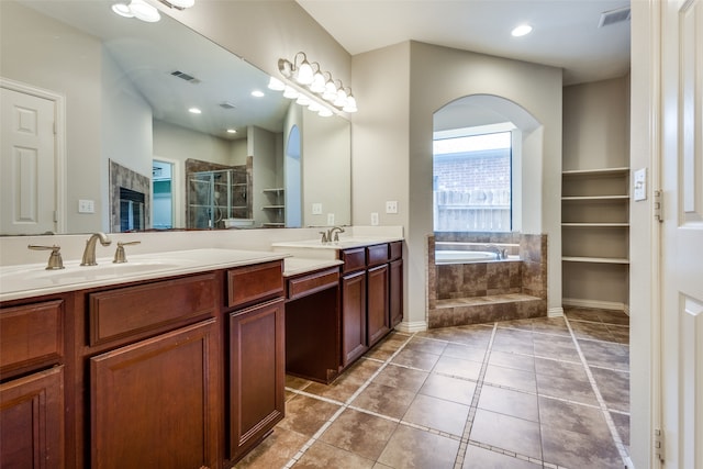 bathroom with vanity, plus walk in shower, and tile patterned floors