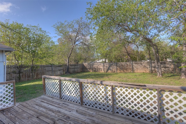 wooden terrace featuring a lawn