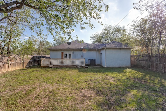 back of property featuring central AC, a yard, and a deck