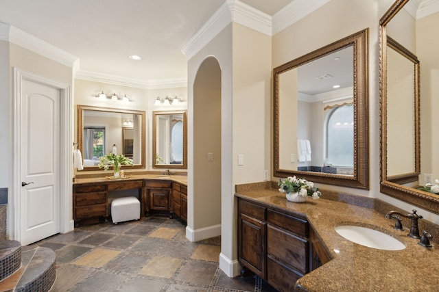 bathroom featuring crown molding and vanity