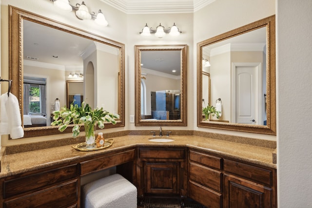 bathroom with vanity and crown molding