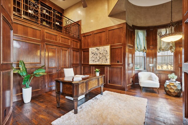 living room featuring ornamental molding, hardwood / wood-style floors, and a fireplace