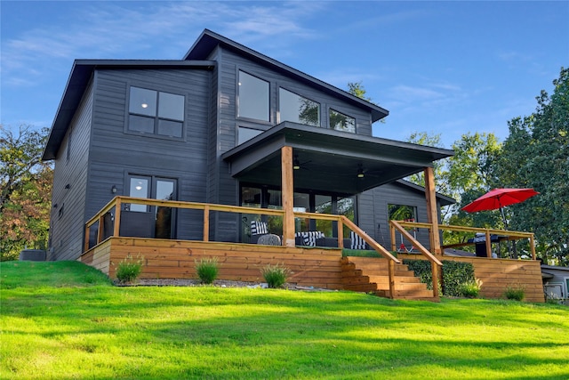 rear view of property featuring a lawn