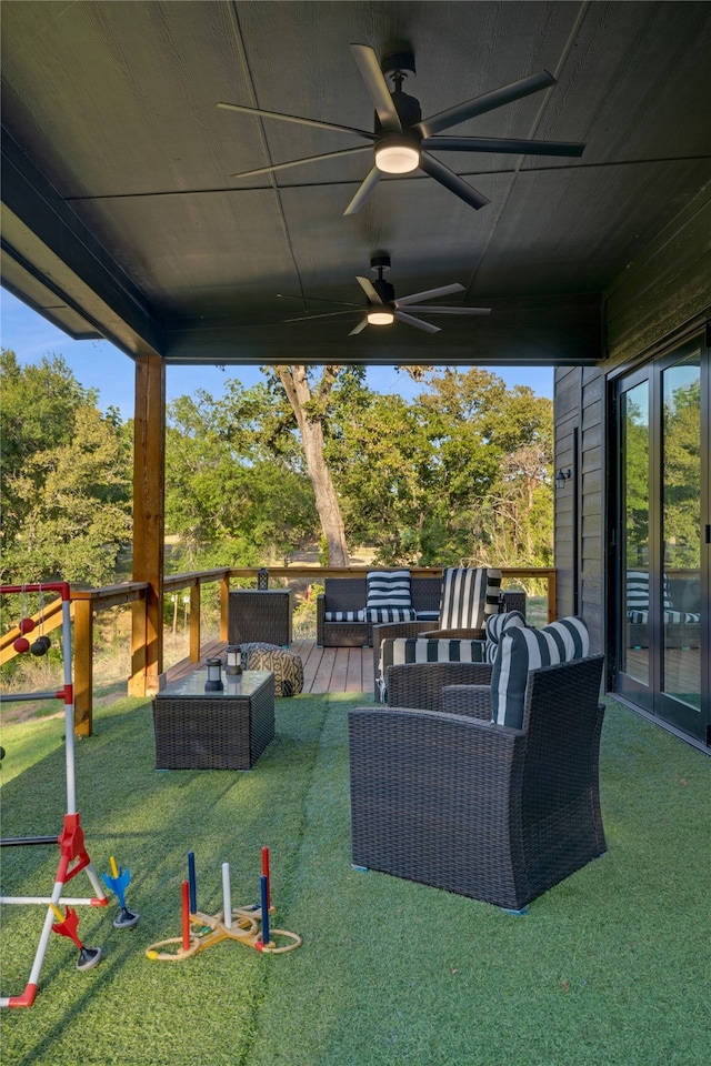 view of patio with outdoor lounge area and ceiling fan