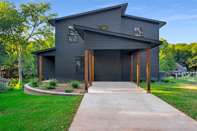 contemporary house featuring a front yard and a porch