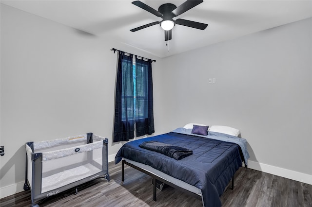 bedroom featuring wood-type flooring and ceiling fan