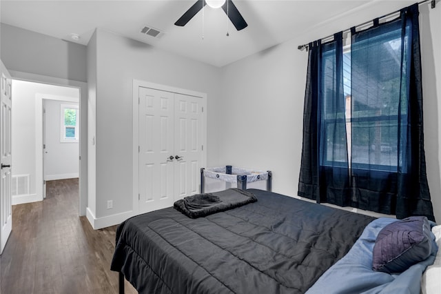 bedroom featuring a closet, ceiling fan, and dark hardwood / wood-style floors