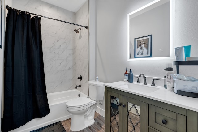 full bathroom featuring vanity, toilet, hardwood / wood-style flooring, and shower / bathtub combination with curtain