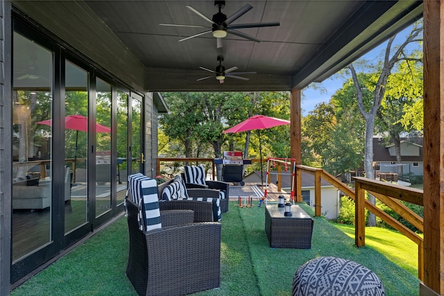 view of patio featuring an outdoor living space, ceiling fan, and a deck