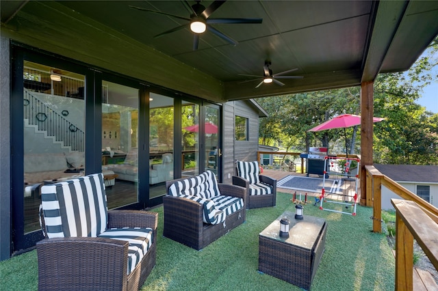 view of patio with outdoor lounge area, ceiling fan, and a deck