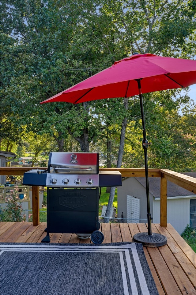 wooden terrace featuring grilling area