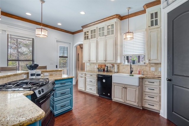 kitchen with light stone countertops, dishwasher, range with gas stovetop, and pendant lighting