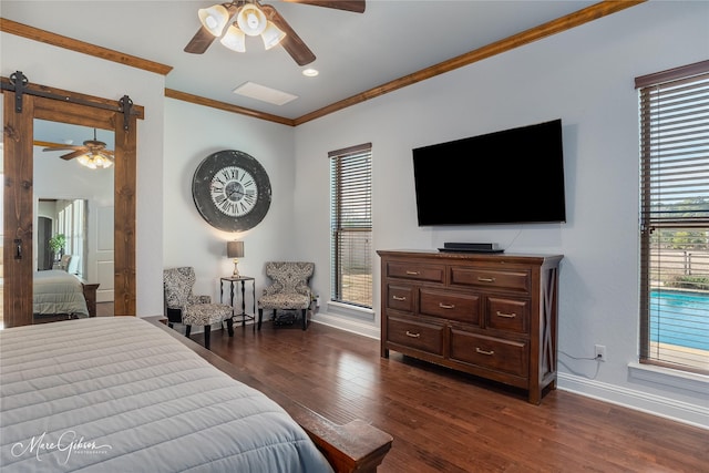 bedroom featuring ceiling fan, dark wood-type flooring, ornamental molding, and a barn door