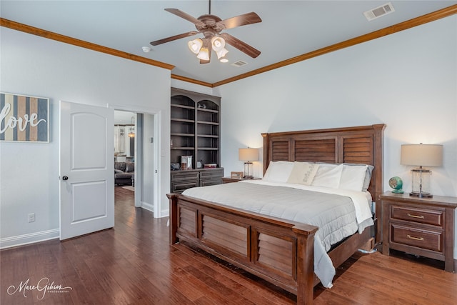 bedroom featuring ceiling fan, dark hardwood / wood-style flooring, and crown molding