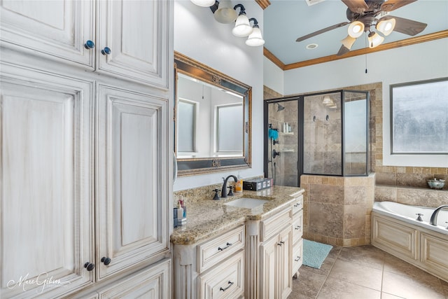 bathroom featuring ceiling fan, plus walk in shower, tile patterned flooring, crown molding, and vanity