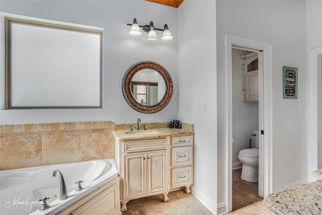 bathroom featuring toilet, tile patterned floors, a bathtub, and vanity