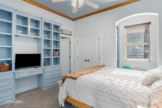 bedroom with ceiling fan, light carpet, a closet, and crown molding