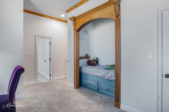 carpeted bedroom featuring crown molding