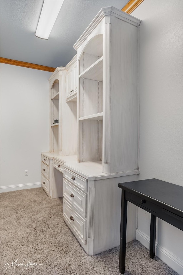 walk in closet featuring light colored carpet