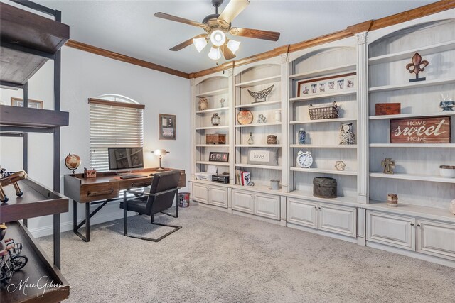 carpeted home office featuring ceiling fan and ornamental molding