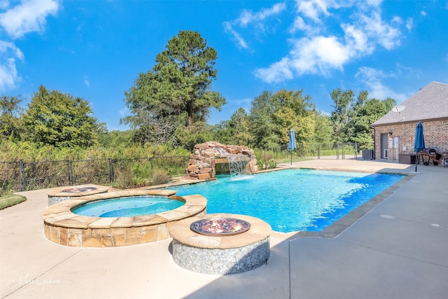 view of swimming pool with an outdoor fire pit, central AC unit, a patio area, pool water feature, and an in ground hot tub