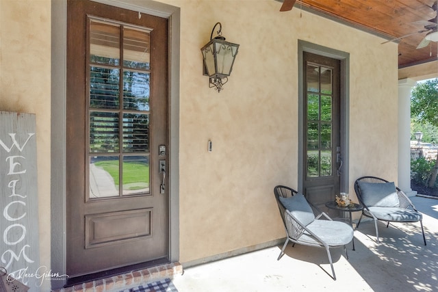 entrance to property with ceiling fan