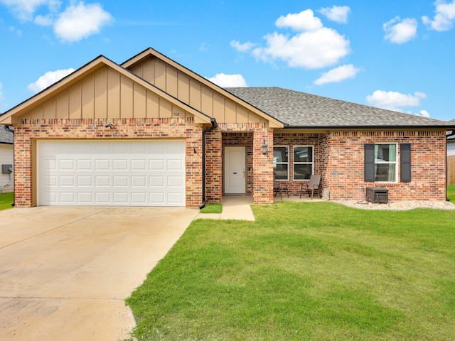 view of front of property featuring a garage and a front lawn