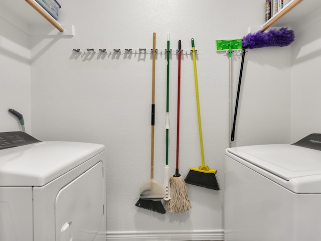 washroom featuring washer and dryer