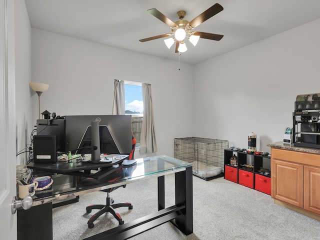 office area with light colored carpet and ceiling fan