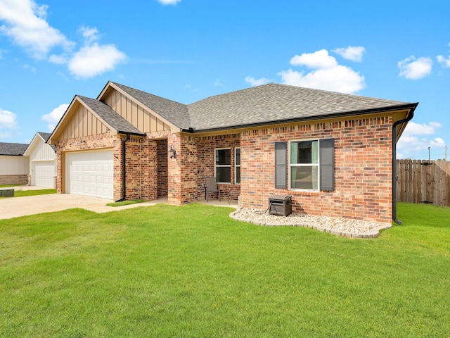 single story home with a front lawn and a garage