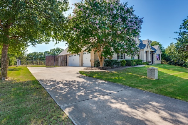 obstructed view of property with a front yard