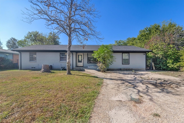 ranch-style home with a front yard