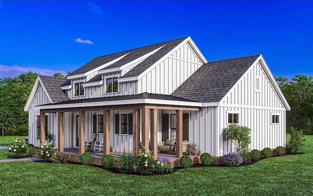 modern farmhouse featuring covered porch and a front lawn