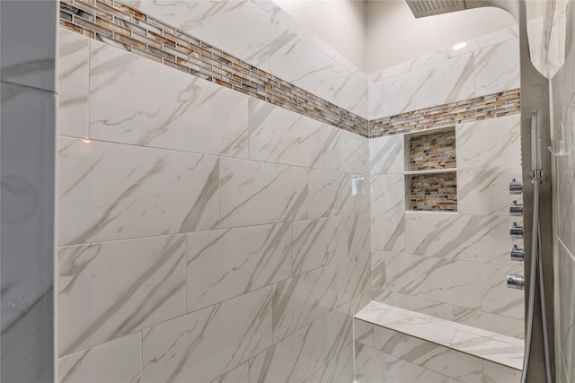 bathroom featuring tiled shower