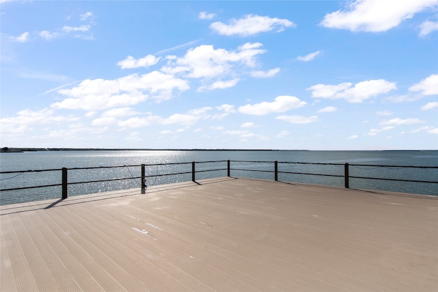 wooden deck featuring a water view